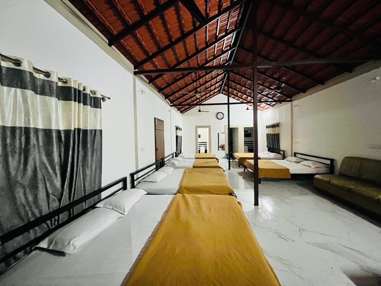 The family room with beds in a row under a tiled roof